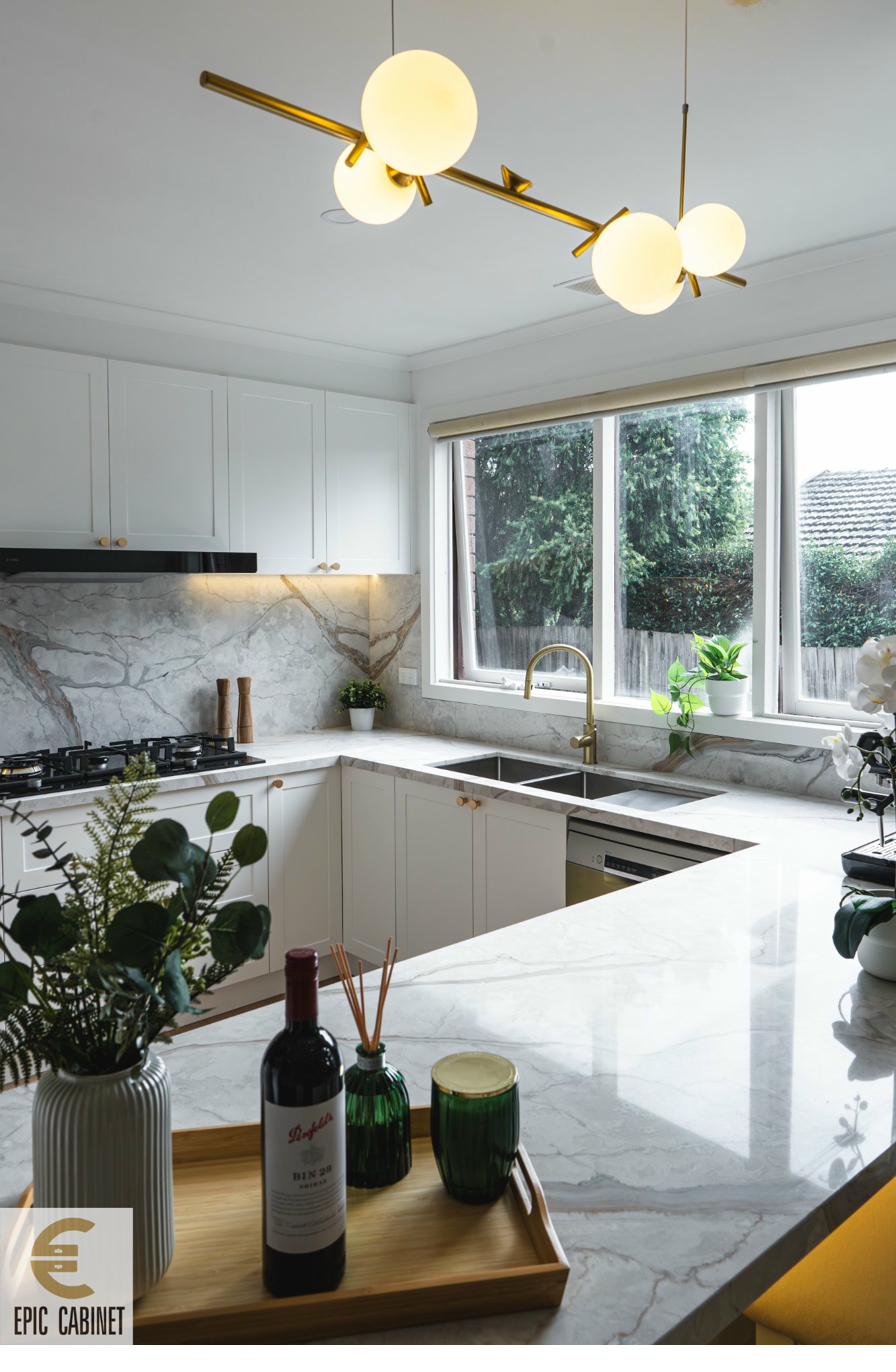 Stone benchtop with veined marble and custom cabinetry by Epic Cabinet